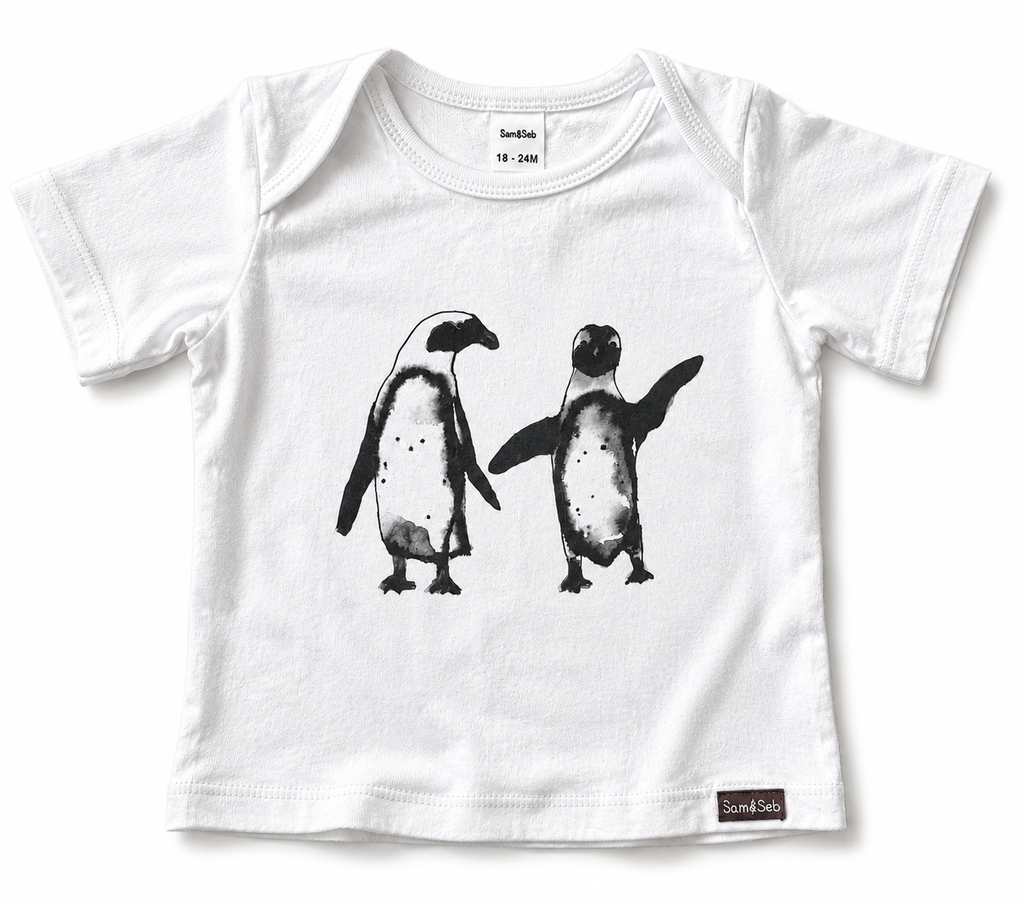 A white short-sleeve baby t-shirt featuring a black watercolor-style graphic of two penguins on the front. The brand name 'Sam & Seb' is visible on both the inner neck label and the bottom hem tag.